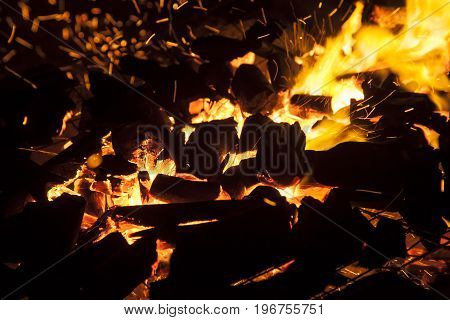 Hot sparking live-coals burning in a barbecue