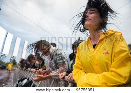 Headbanging Crowd In The First Row At A Hardcore Concert