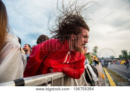 Headbanging Crowd In The First Row At A Hardcore Concert