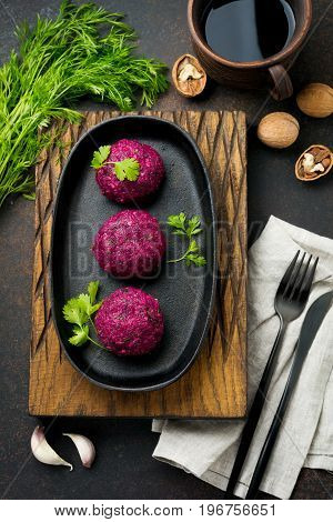 Snack of beet cabbage walnut and cilantro. Traditional Georgian dish Pkhali. Selective focus.Top view. Copy space.
