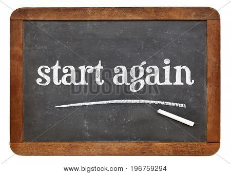 start again sign - white chalk text on a vintage slate blackboard