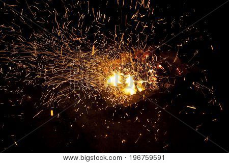 Hot sparking live-coals burning in a barbecue