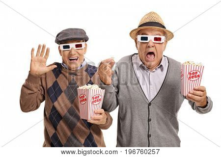 Terrified seniors with 3D glasses and popcorn isolated on white background