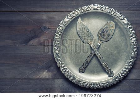 Few Vintage Silver Kitchen Utensil With Ornaments On Silver Tray