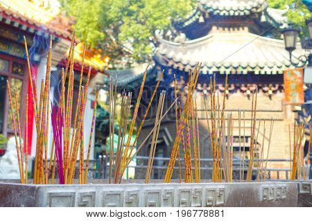 HONG KONG, CHINA - JANUARY 22, 2017: Close up of incenses burning up, inside of Wong Tai Sin Buddhist Temple to pray, in Hong Kong, China.