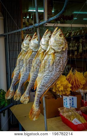 Fresh fish over a newspaper in a market in fishermen town in lantau, Hong Kong, China.