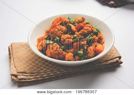 indian spicy food Gobi matar Masala or cauliflower curry with green peas or phool gobi fry, selective focus