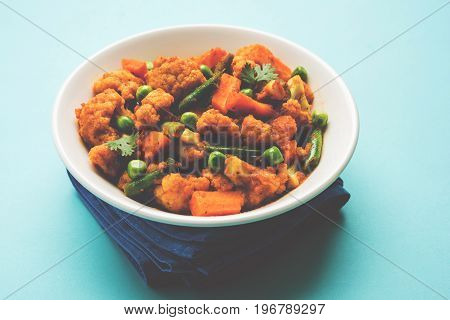 indian spicy food Gobi matar Masala or cauliflower curry with green peas or phool gobi fry, selective focus