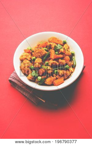 indian spicy food Gobi matar Masala or cauliflower curry with green peas or phool gobi fry, selective focus