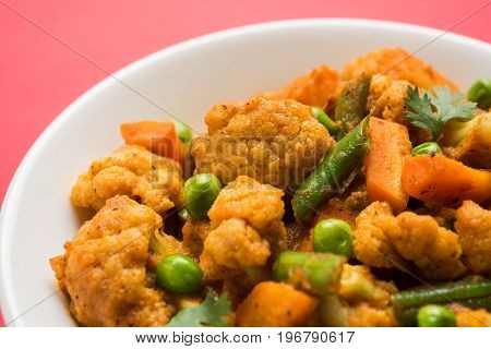 indian spicy food Gobi matar Masala or cauliflower curry with green peas or phool gobi fry, selective focus