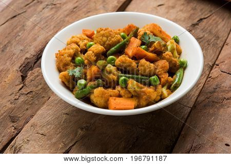 indian spicy food Gobi matar Masala or cauliflower curry with green peas or phool gobi fry, selective focus