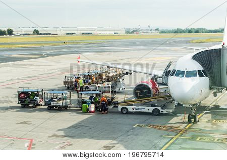 PRAGUE, CZECH REPUBLIC - JUNE 16, 2017: Vaclav Havel Prague International Airport, Ruzyne, Czech Republic. Loading luggage in the airplane.