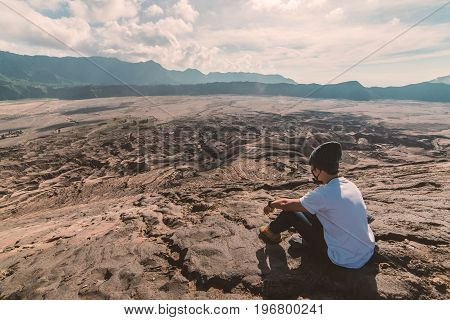 Man On Top Of Layer Volcanic Ash As Sand Ground Of Mount Bromo Volcano (gunung Bromo) At Bromo Tengg