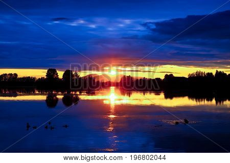 A view of a sunset over Susitna mountain in Alaska