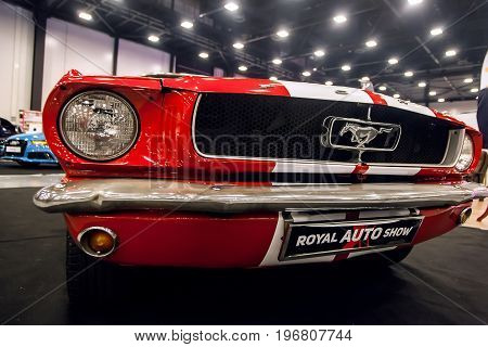 SAINT-PETERSBURG, RUSSIA - JULE 23, 2017: Front view of Classic Ford Mustang GT 390 on Royal Auto Show. Close up of Car hood and radiator with headlamp