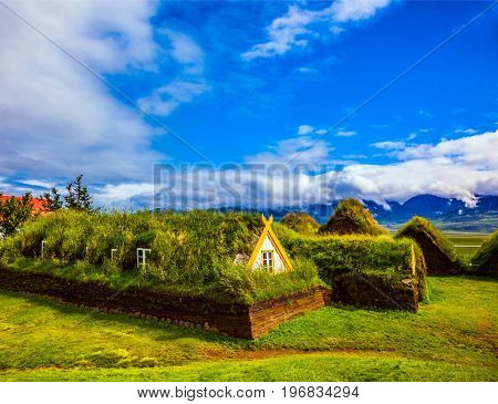 Museum-estate Glaumbaer, Iceland. The concept of the historical and ethnographic tourism. Church bell tower with a peaked red roof in old village 