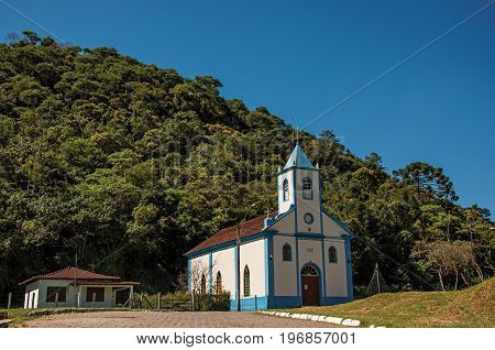 Visconde de Mauá, Brazil - January 19, 2015. View of small church with belfry and forest in Visconde de Mauá, a village in the middle of mountains an trees. Rio de Janeiro State, southwestern Brazil