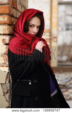 woman with a sly look in an abandoned building