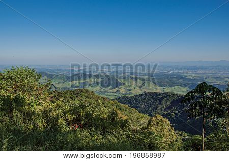 Panoramic view of forest, hills, mountains and blue sky in Penedo, a tourist town founded by Finns who still has strong influence of this culture. Located in Rio de Janeiro State, southwestern Brazil