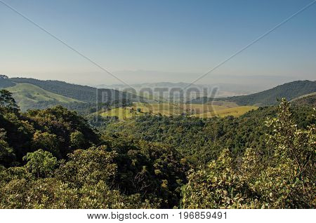 Overview of hills and peaks covered by forests in the Itatiaia Park, an altitude park, known for its animal diversity, trails and waterfalls. Located in the Rio de Janeiro State, southwestern Brazil