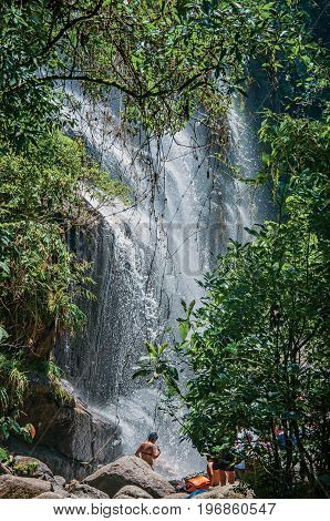 Itatiaia, Brazil - January 20, 2015. View of waterfall and people in the Itatiaia Park, an altitude park, known for its wildlife, trails and forests. Rio de Janeiro State, southwestern Brazil