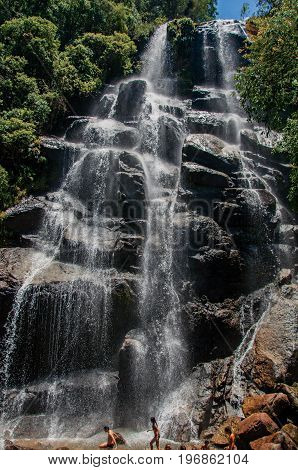 Itatiaia, Brazil - January 20, 2015. View of waterfall and people in the Itatiaia Park, an altitude park, known for its wildlife, trails and forests. Rio de Janeiro State, southwestern Brazil