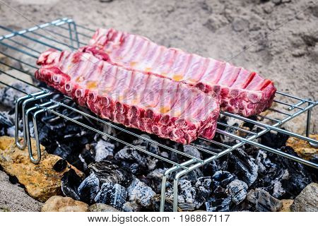 Making Pork Ribs On Homemade Improvised Bbq Barbecue Grill.
