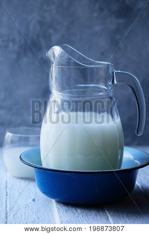 Fresh whey in a large glass jug