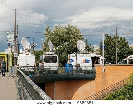 STRASBOURG FRANCE - JUN 30 2017: RTL N:TV TV Media Television Trucks with multiple Satellite parabolic antennas and fiber optic cables preparing to report live the official European Ceremony of Honour for Dr. Helmut Kohl at European Parliament