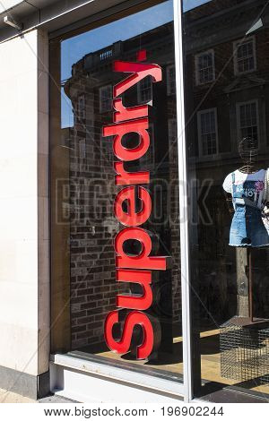 YORK UK - JULY 18TH 2017: The Superdry logo by the entrance to a Superdry retail store in the city of York in England on 18th July 2017.