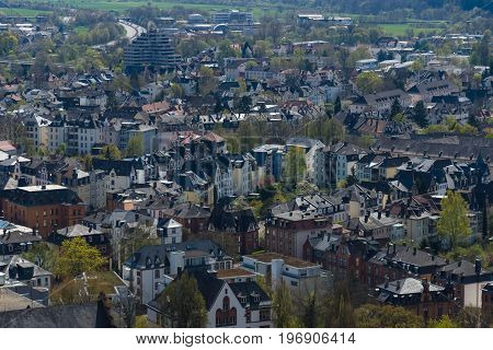 MARBURG GERMANY - APRIL 18 2015: The new and the old part of the city from the surrounding hills. Marburg is a university town in the German federal state (Bundesland) of Hessen.