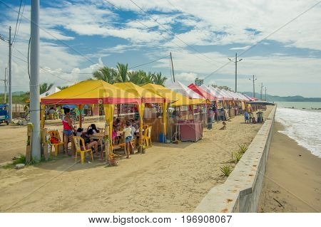 ATACAMES, ECUADOR - March 16, 2016: Unidentified people under a small and rustic tents in Same, Ecuador.