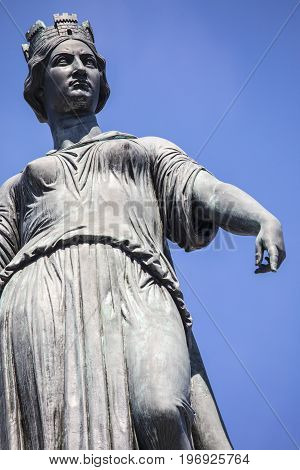 The magnificent statue ontop of the Column of the Goddess situated in Grand Place - the central square in the historic city of Lille in France.