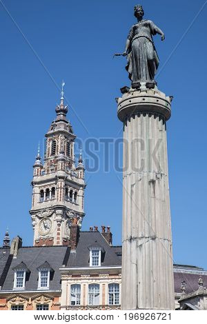 View in Grand Place in the historical city of Lille France. The view includes the Column of the Goddess and the belfry of the Chamber of Commerce and Industry.