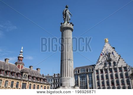 A view of the Column of the Goddess Vieille Bourse and La Voix du Nord headquarters situated in Grand Place in the historic city of Lille France.