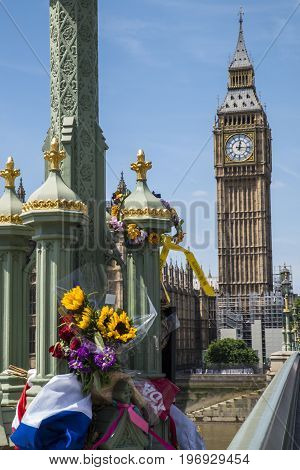 LONDON UK - JUNE 14TH 2017: Flowers and messages on Westminster Bridge in remembrance of the lives lost during the March 2017 Westminster terror attack in London taken on 14th June 2017.