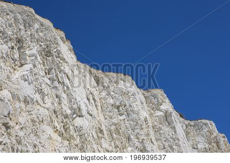 The beautiful chalk cliffs along the coastline in East Sussex in the UK.