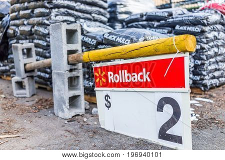Burke, Usa - April 16, 2017: Macro Closeup Of Rollback Two Dollar Sign In Walmart Outside Garden Cen