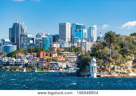 Robertsons Point Lighthouse And North Sydney Cityscape On Sunny Day