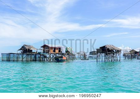 The traditional sea gypsy water village in Bodgaya Island in Tun Sakaran Marine Park,Semporna,Sabah,Borneo,Malaysia.Clear blue water & sandy beach.Beautiful vacation & destination.
