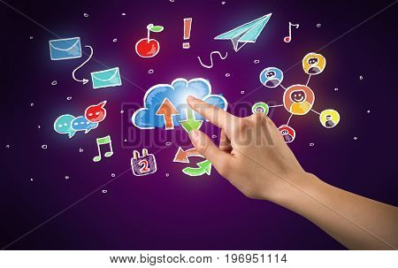 Female hand toucing mixed media icons with purple background