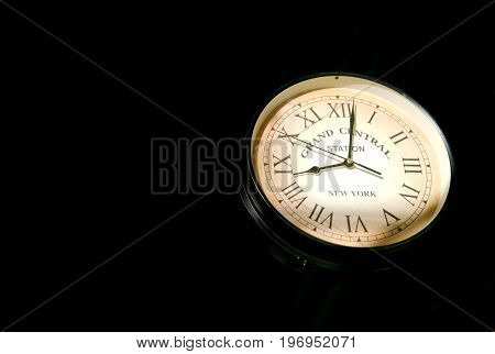 Image of a clock showcasing mock grand central station and railway station time.