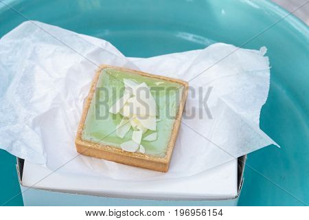 Green Keylime Tart Pastry With A Cookie Crust And White Chocolate Flakes
