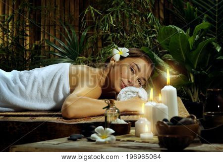portrait of young beautiful woman in spa environment.