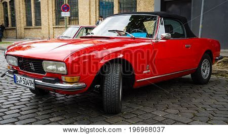 BERLIN - MAY 10 2015: Large family car Peugeot 504 convertible. 28th Berlin-Brandenburg Oldtimer Day