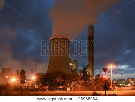 an old coal power plant at night with long time exposure