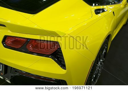 Sankt-Petersburg Russia July 21 2017: Back view of a yellow sport car Chevrolet Corvette Z06. Car exterior details. Photo Taken on Royal Auto Show July 21