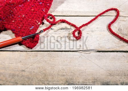 Red Woollen String And Chrochet Hook On Wood, Hobby Handiwork