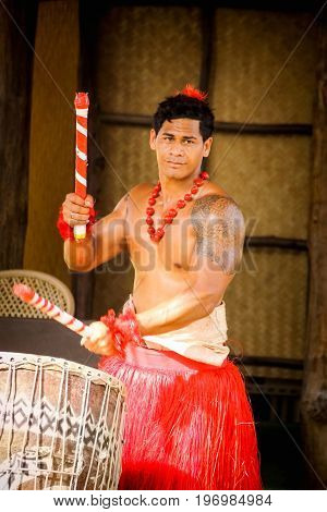 Honolulu Hawaii - May 27 2016: A Tongan man performs for audiences at the Polynesian Cultural Center a popular tourist attraction on Oahu.