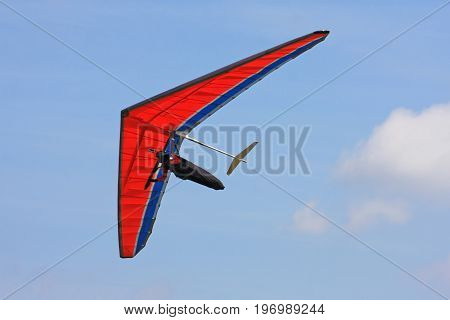 Hang Glider flying in a blue sky